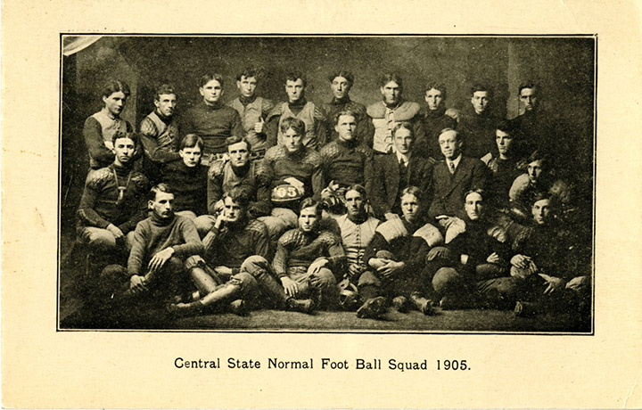 Central State Normal School’s football team poses for a group photo in a sepia tone colored photo from 1908.