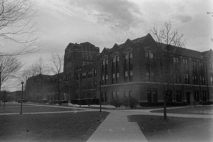 Warriner Hall on a cloudy day, captured on black and white film.