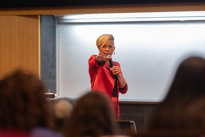 Former Civil Rights attorney Diana Patton points to a crowd of students while giving a keynote.