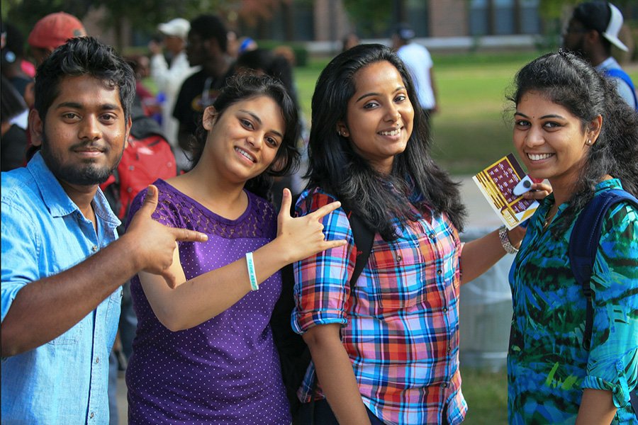 A group of international students pose for the camera during CMU's annual Get Acquainted Day