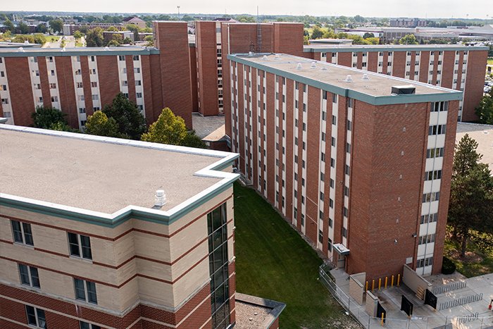 Aerial view of Troutman Hall on Central Michigan University campus with side walks, green grass and a parking lot.