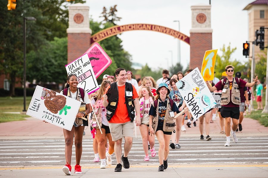 Leadership Safari students crossing the road with signs