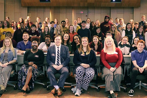 Members of the Residence Housing Association pose for a group photograph.