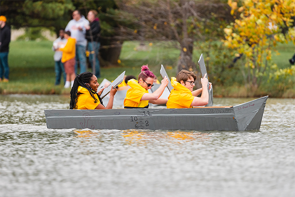 CMU students in the annual Homecoming cardboard boat race