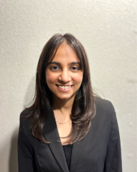 Pratichee Headshot of Pratichee in a black suit