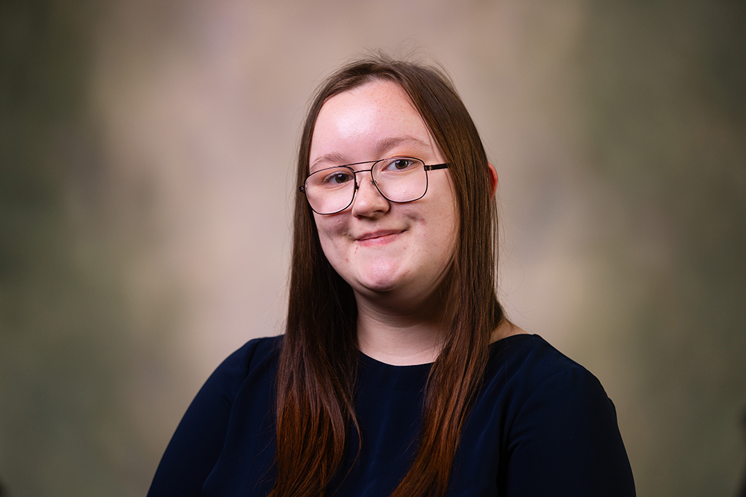 Professional headshot of Aaliyah Lannon wearing a black sweater while looking at the camera.