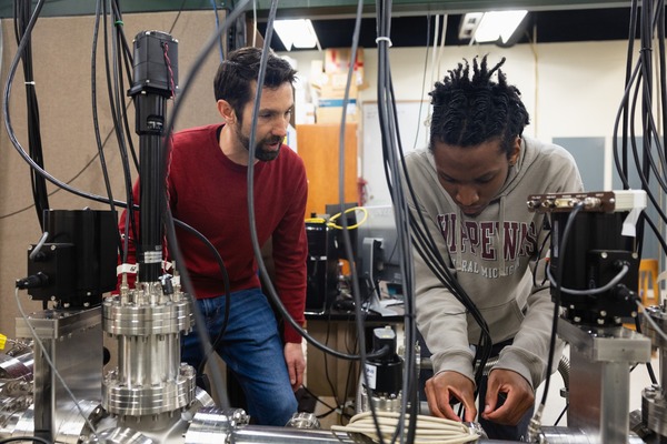 CMU professor providing guidance to a student in the lab.