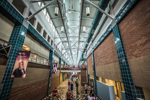 Students walking through CMU's Engineering and Technology Building.