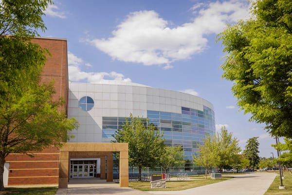 Central Michigan University's main library building, featuring a large glass facade.