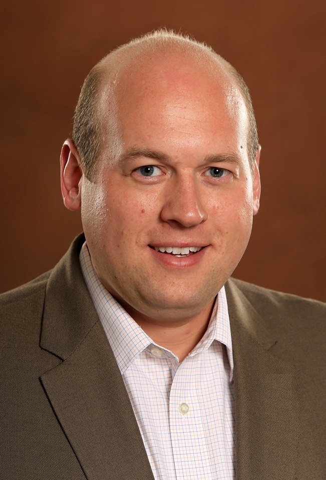 a man in a brown suit