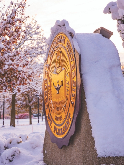 The CMU Seal on a snowy morning.